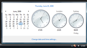 Windows Vista displaying a calendar and multiple clocks in the taskbar