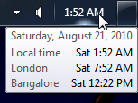 Windows 7 displaying three different clocks in the tray